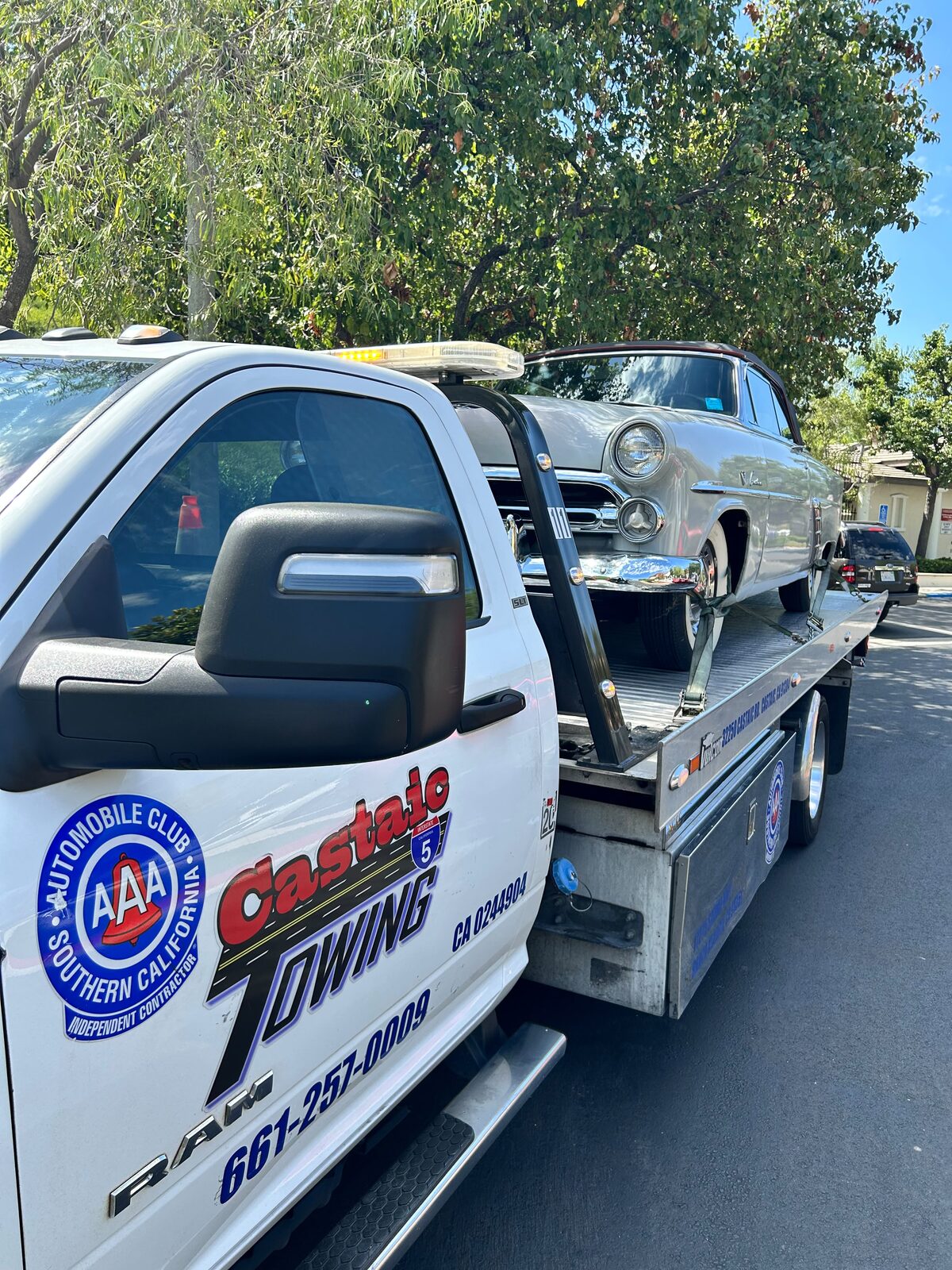 Classic Ford convertible loaded on a Castaic Towing flatbed