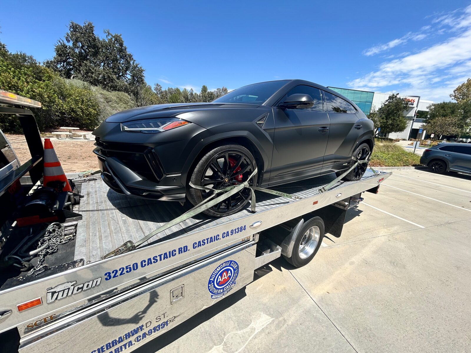 Castaic Towing flatbed hauling a Lamborghini Urus